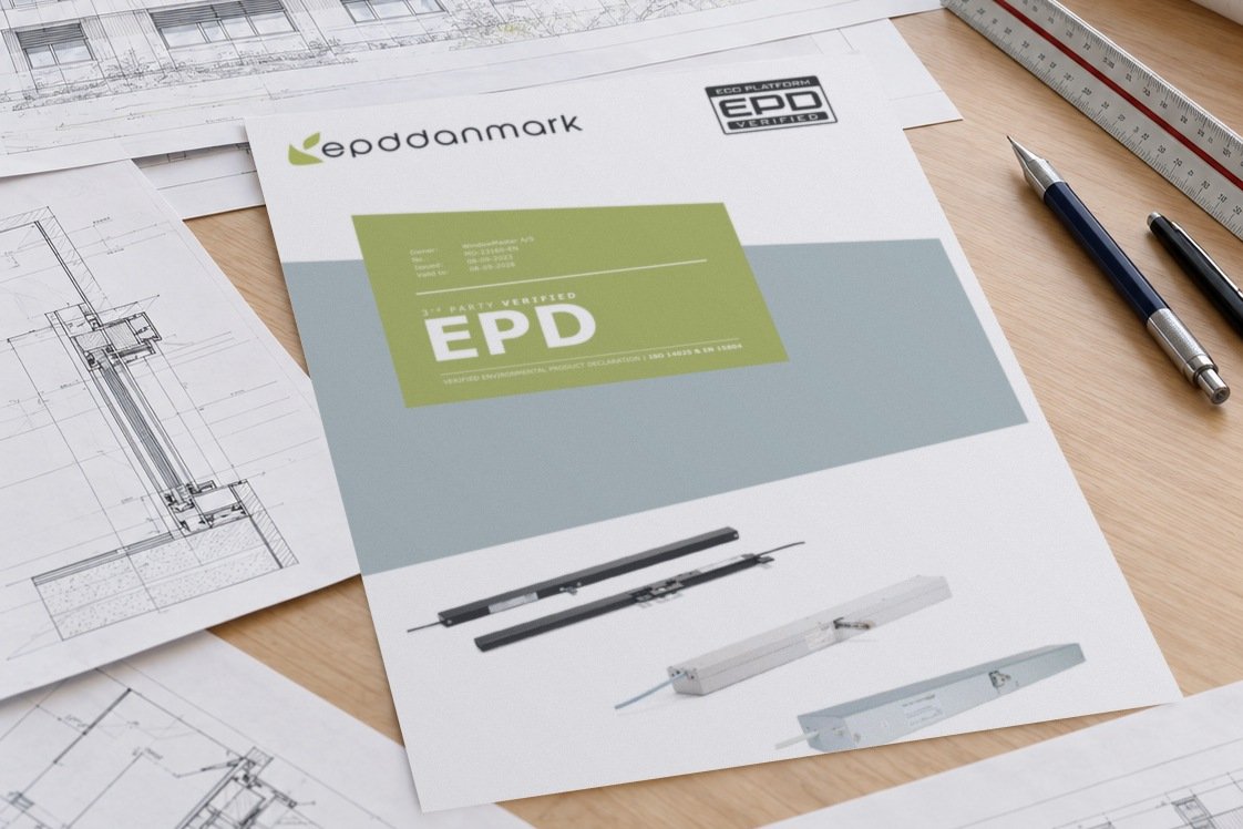 WindowMaster actuator EPD cover among architectural drawings on a desk